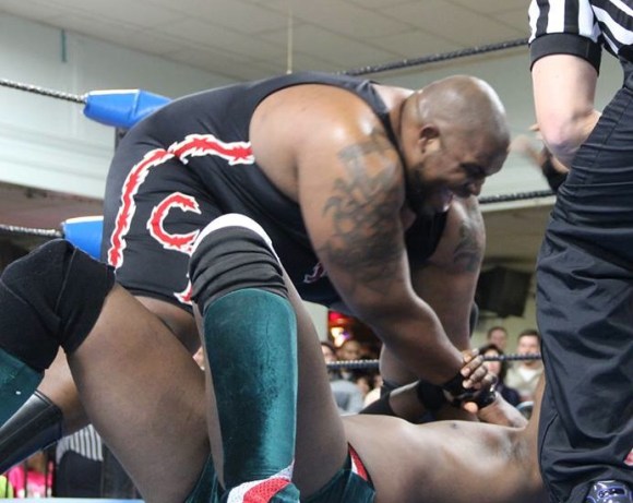 Barackus demonstrates his incredible hand strength by treating Da'Marius Jones' head like a stress ball.  Photo: Maurice Ramsey